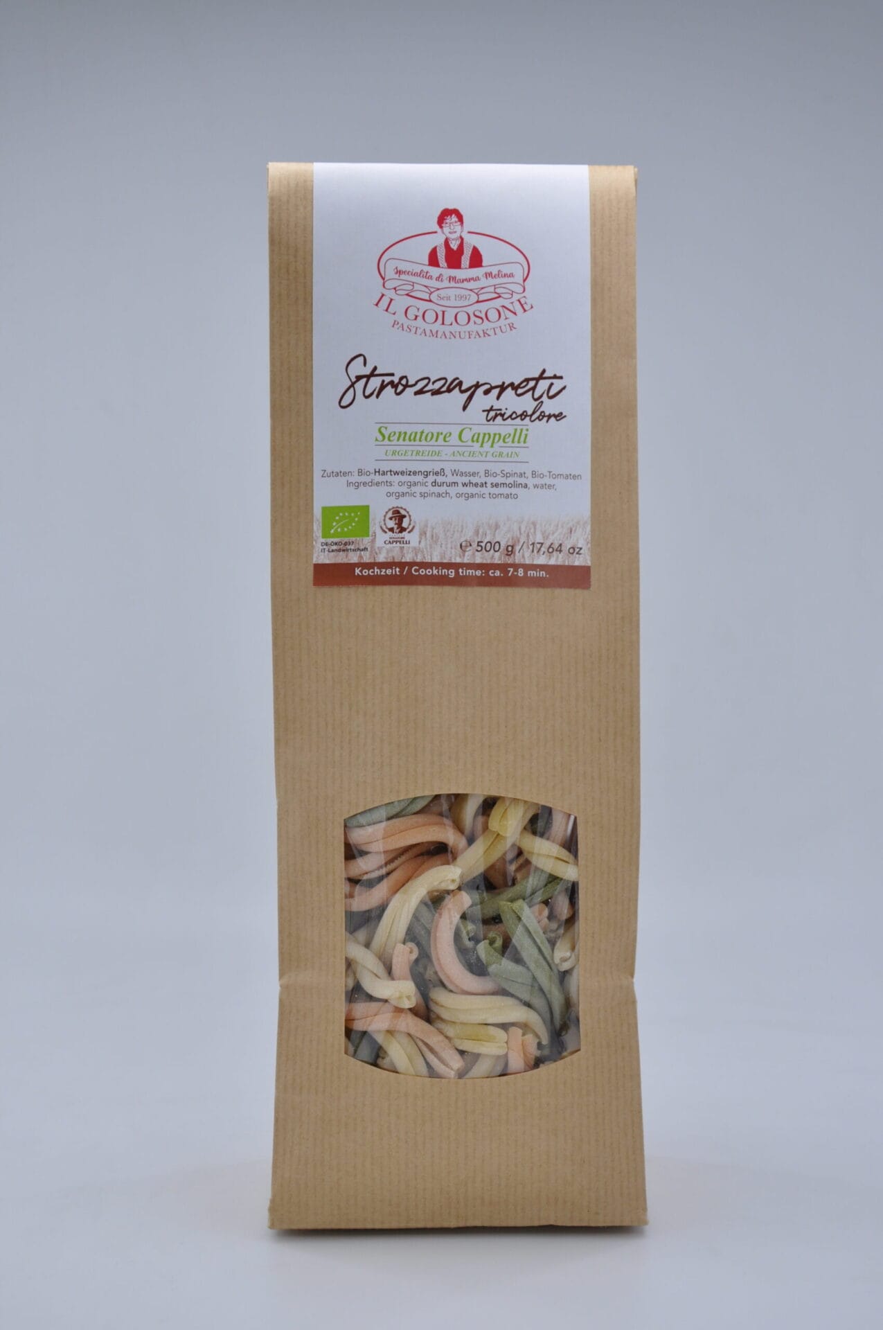 Bunte Farfalle-Nudeln in Pastellfarben.